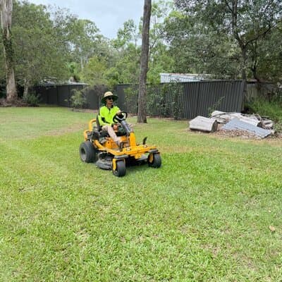 Green Mowers team member mowing a larger property